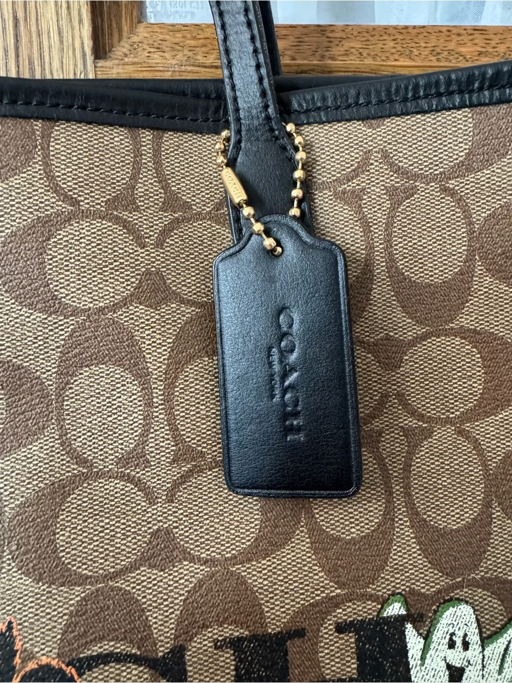 Coach Brown Signature Canvas Tote with Black Straps and Halloween Motifs